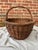 Large vintage woven oval willow gathering basket with a simple twisted top handle. Wear consistent with age, use, there...
