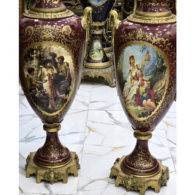 Make a bold statement with this elegant burgundy porcelain vase, designed in a refined French style. The rich guinda...