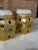 A striking pair of vintage brass Chinese garden stools featuring pierced and embossed decoration throughout. Each...