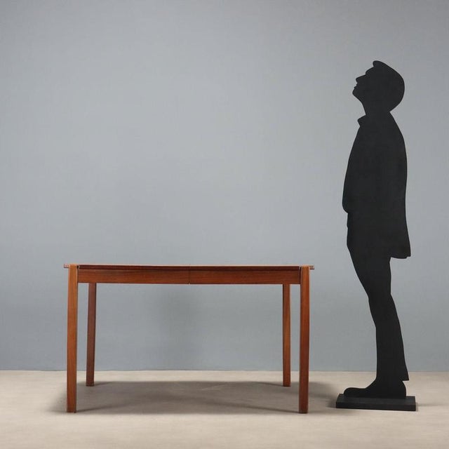 Dining table from the 1960s of Italian manufacture, characterized by an elegant and functional design. The sturdy...