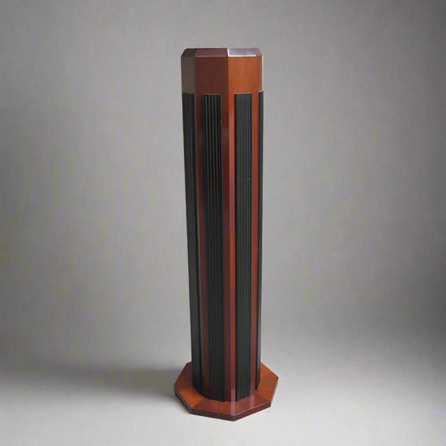 An octagonal Art Deco period display pedestal column from France circa 1930. Hardwood featuring eight raised, vertically...