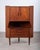 A refined Danish corner cabinet in teak, produced in the 1960s. Designed to make elegant use of space, this piece offers...