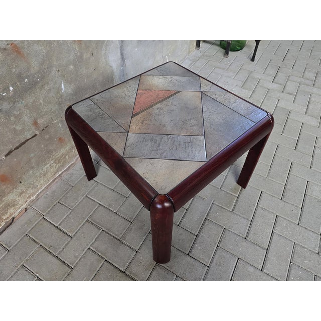 This stunning table has been designed and made during the 1970's in Denmark. This four-legged table is most likely made of...