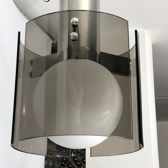 Great vintage condition for this vintage chandelier produced by Veca during the 60s. It is made from chrome, glass and...