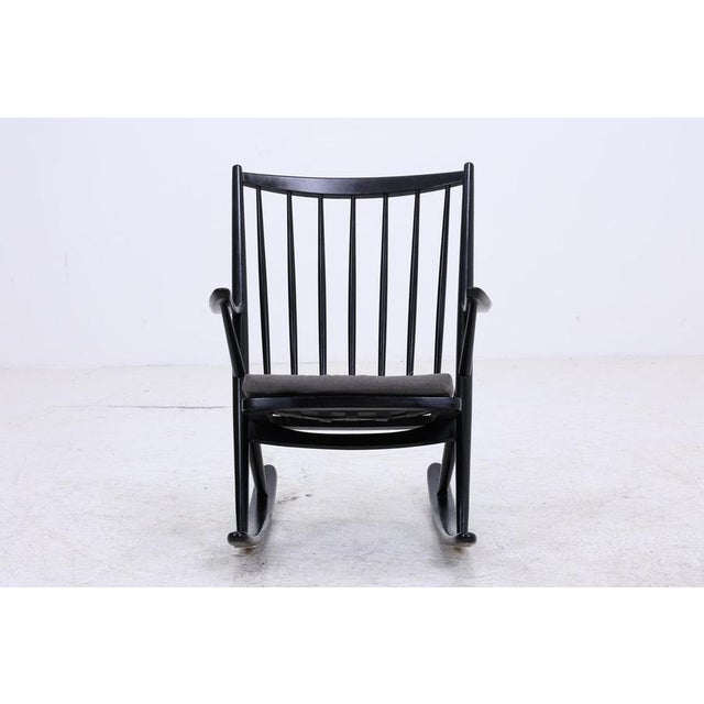 Beautiful vintage rocking chair, model 182, by Frank Reenskaug for Bramin, with a striking, sculptural form and clean...