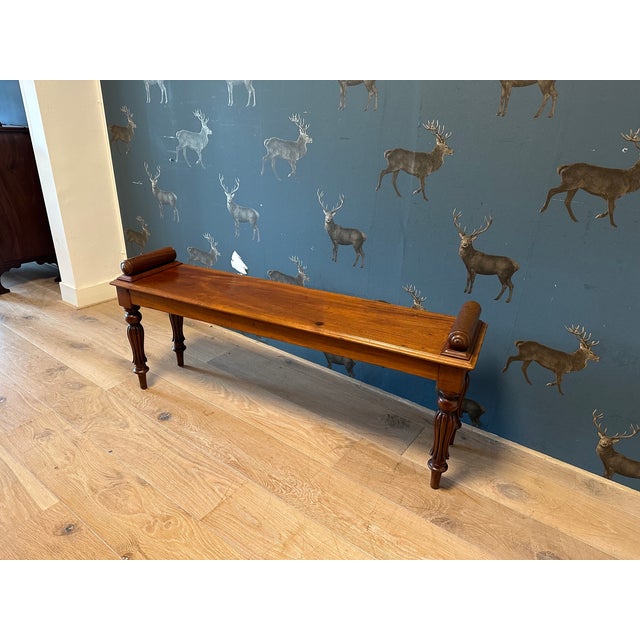 Beautiful mahogany window seat, versatile enough for various uses—for instance, as a small daybed. It features a warm tone...