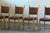 A characterful set of four vintage oak dining chairs with a strong Scandinavian folk-modern feel. The combination of solid...