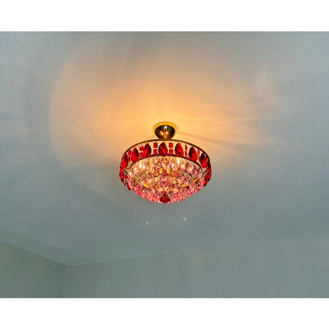 Bring a touch of romantic elegance and vibrant color to your space with this wonderful vintage crystal chandelier....