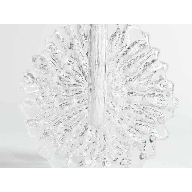 This is a striking three-piece Scandinavian modern art glass set comprising a textured disk vase and a matching pair of...