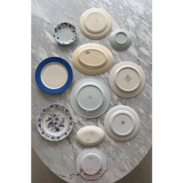 A French Country theme and color story in shades of blue on white and off white porcelain and ironstone bring a pleasing...