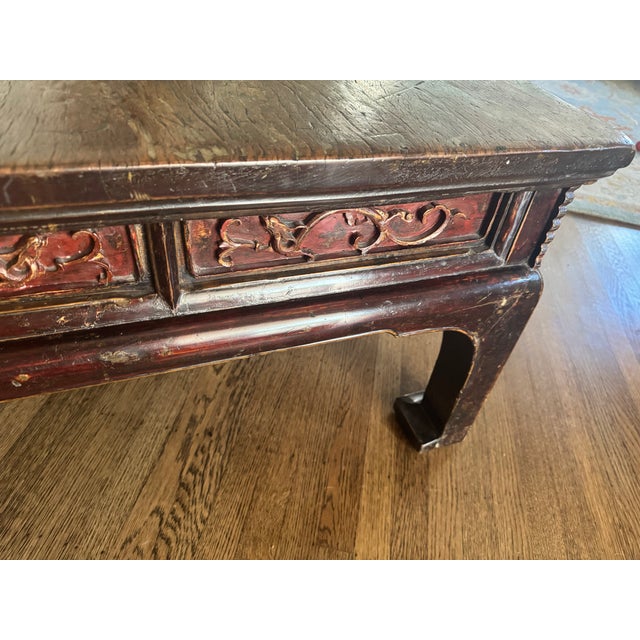 Solid elm, this table has classic Ming and Qing dynasty features; the beaded edge along the apron, the carved scrolling...