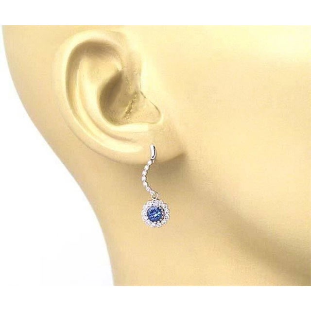 Crafted with sophistication, these Diamond & Sapphire Dangle Earrings are a timeless addition to any jewelry collection....