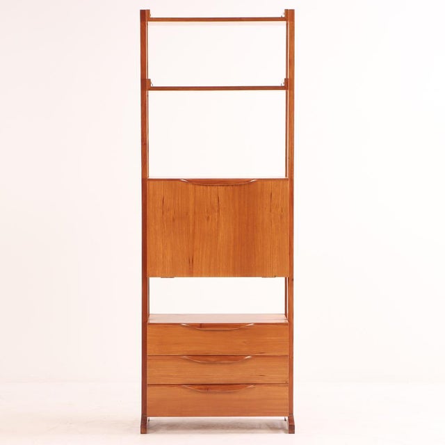 A beautifully crafted mid-century fall-front desk and bookshelf unit made in Argentina, circa 1950. Constructed from...