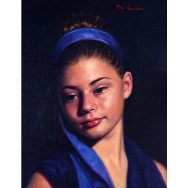This oil painting depicts a young girl with a serene expression, her gaze softly averted. The deep blues of her headband...