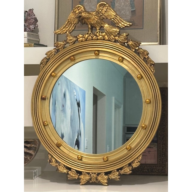 Vintage American Federal Revival giltwood eagle crest round mirror This piece would be handsome displayed above a chest,...