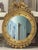 Vintage American Federal Revival giltwood eagle crest round mirror This piece would be handsome displayed above a chest,...