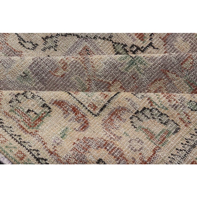 Mid 20th Century Vintage Turkish Distressed Oushak Rug With All-Over Floral Design in Lilac Color For Sale - Image 12 of 13