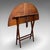 This is an antique kitchen garden table. An English, mahogany folding coaching or occasional table, dating to the late...