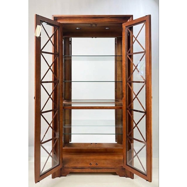 Fine late 20th-century lighted display cabinet or vitrine by Hickory White Furniture Company. Crafted with exceptional...