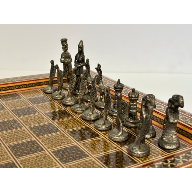 An exceptionally decorative Persian Khatam chess set, handcrafted with intricate geometric micro-mosaic marquetry and...