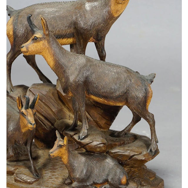 A delicately hand carved wood sculpture of a chamois family. A very detailed and natural carving by the Austrian...