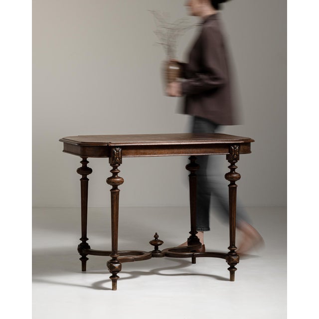A versatile table from the Napoleon III period, featuring elegant proportions and a balance between decoration and...