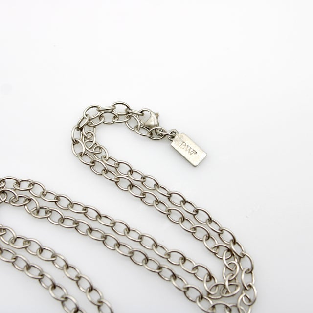 This vintage sterling silver open link chain has a great length and substantial presence on the neck. It consists of open...