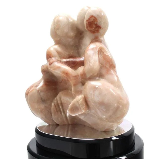 Nice Mid-Century Modern carved marble abstract on revolving pedestal.