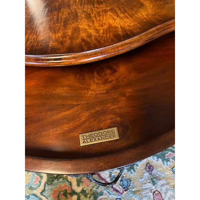 Beautiful flame mahogany end table by Theodore Alexander. Bookmatched sunburst top, cabriole legs with ormalu accents and...