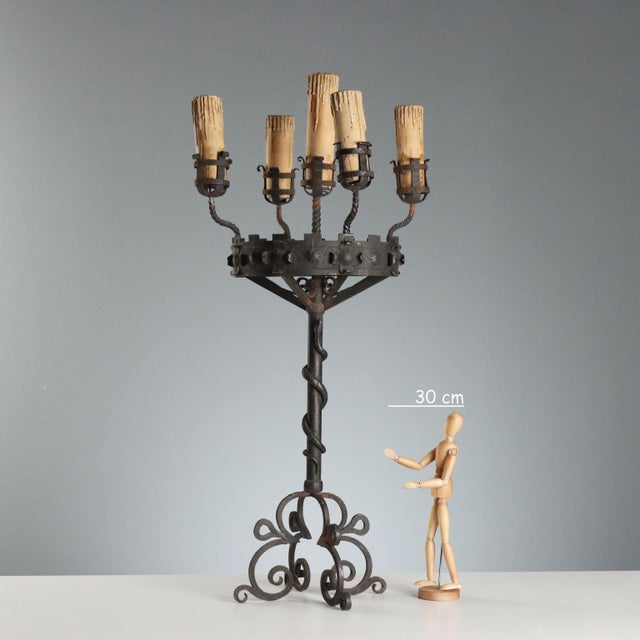 Late 19th-century wrought iron torchère from Italy, featuring an elaborate and detailed design. It has five lights, with...