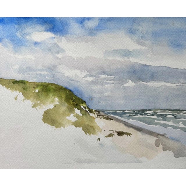 This watercolor depicts the serene landscape of South Padre Island, capturing the gentle undulations of sandy dunes...