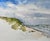 This watercolor depicts the serene landscape of South Padre Island, capturing the gentle undulations of sandy dunes...