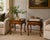 An elegant pair of vintage Baker Furniture French Provincial side tables crafted from richly grained walnut with...