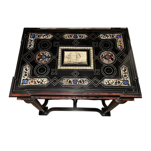 An elegant Italian Baroque-style table dating to the late 18th century, distinguished by its richly decorated top and...