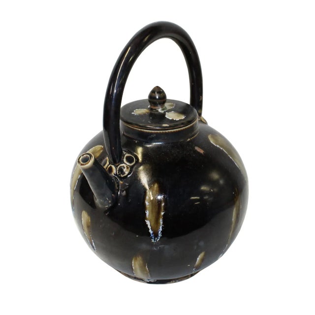 This is a handmade Chinese accent decorative art made of ceramic in brown black mix color. This piece has a twist pattern...