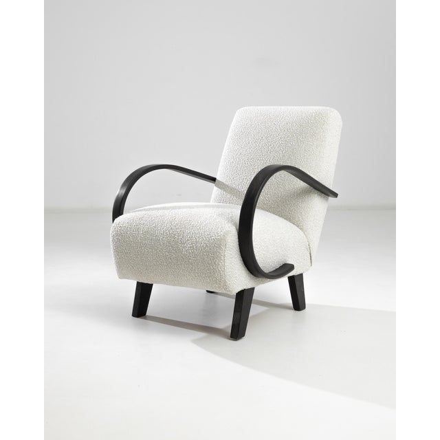 Introducing the 1950s Czech Wooden Armchair by J. Halabala, a timeless piece that combines vintage charm with modern...