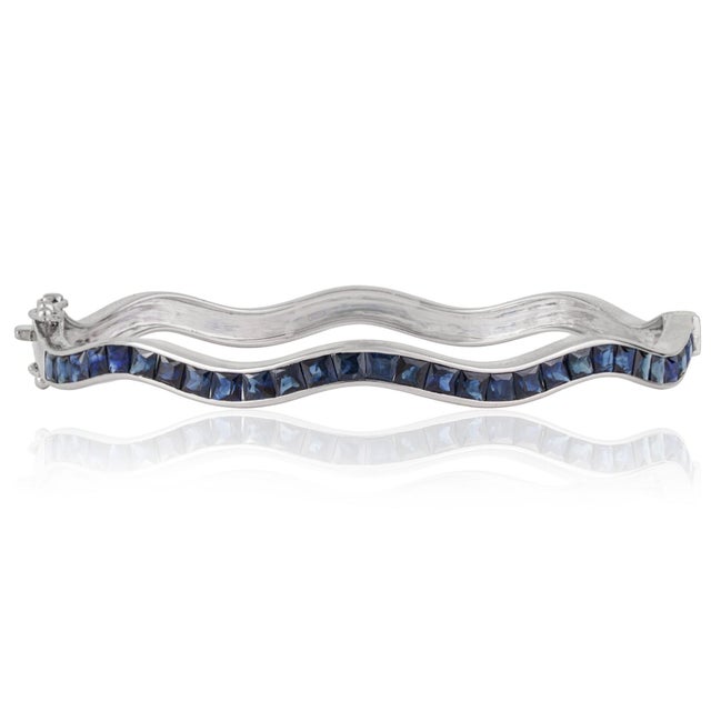 Contemporary Versatile 4.75 Ct Blue Sapphire Channel Set Hinged Wave Bangle Bracelet by Carat&Her For Sale - Image 3 of 12