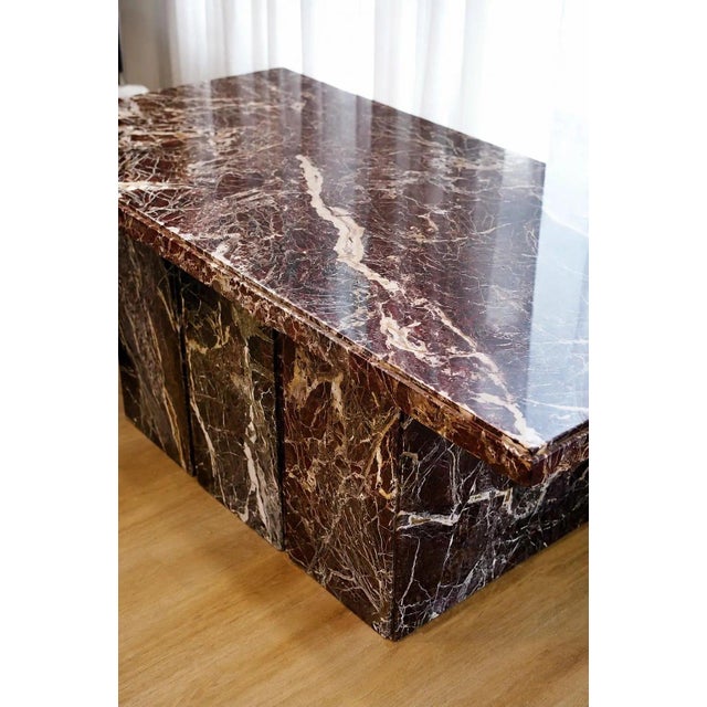 A vintage red plinth marble table crafted from solid Rosso Levanto marble, distinguished by its deep burgundy coloring,...