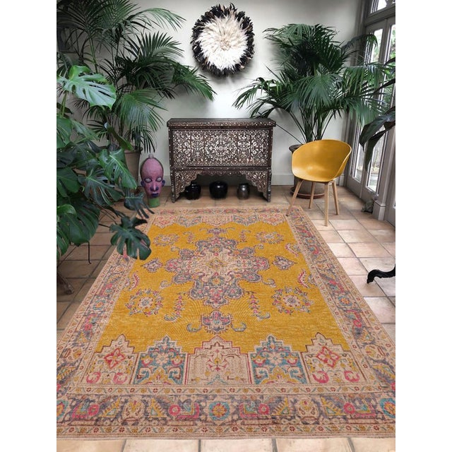Enhance your living space with this stunning vintage Persian hand-knotted wool rug, a true showstopper that effortlessly...
