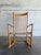 This classic rocking chair features a tall spindle back and sweeping curved armrests. Its timeless aesthetic highlights...