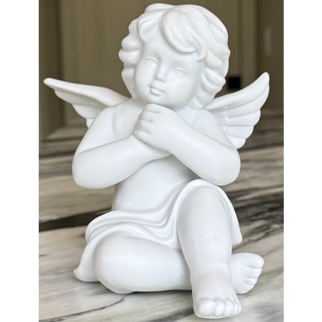 From the fine porcelain maker with historical partnerships with Versace, we present a Rosenthal white porcelain cherub. A...