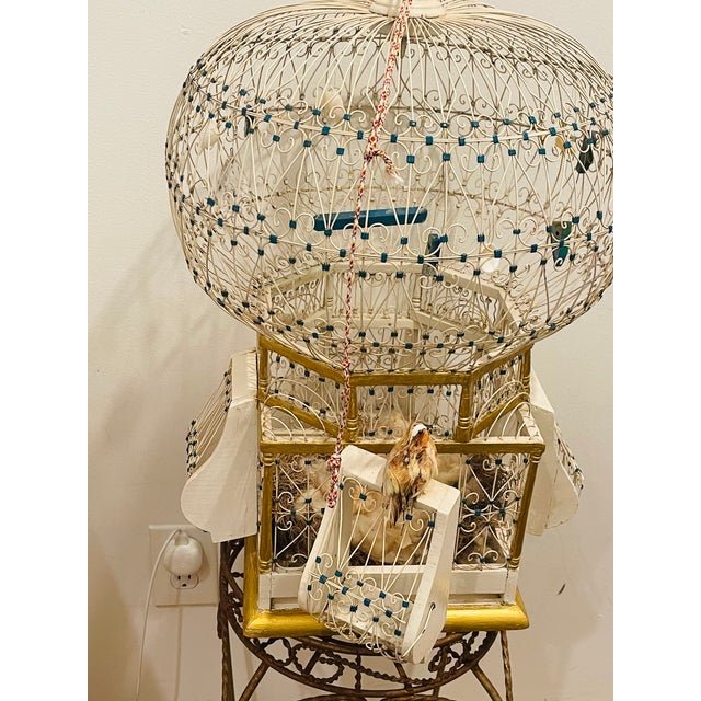 Antique handmade domed wire birdcage with decoration. Stand is not included.