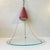Unusual Stilnovo inspired pendant lamp in Brass, Glass and Aluminum. It's fashioned from a maroon colored shade beneath...