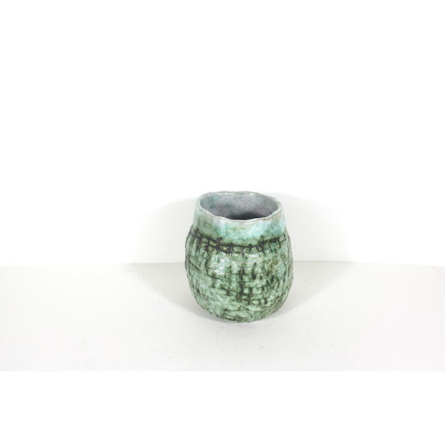 Stunning vintage handmade pottery vase with green glaze, highlighted with black. Rustic, primitive and organic with great...