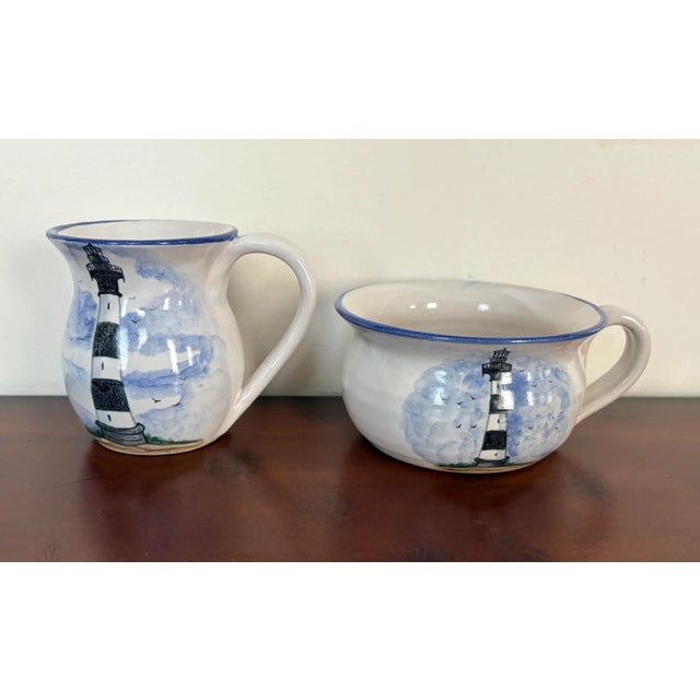 Pitcher and mug set from Cagle Road pottery based in Seagrove,North Carolina and features a lighthouse and a sailboat hand...