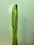 Striking Mid-Century Modern swung glass vase featuring an elegant elongated neck with an oval stretched opening and a...