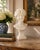 A beautifully carved Carrara marble bust of a young woman, created in France during the 1920s and signed by sculptor Paul...