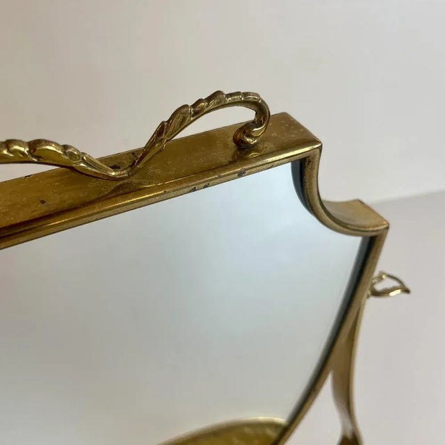 Italian brass table mirror with wood on the back attributed to Gio Ponti.