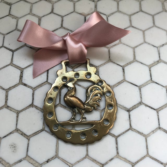Antique English horse brass ornament with satin rose gold ribbon hanger. Horse brasses were used to decorate shire and...