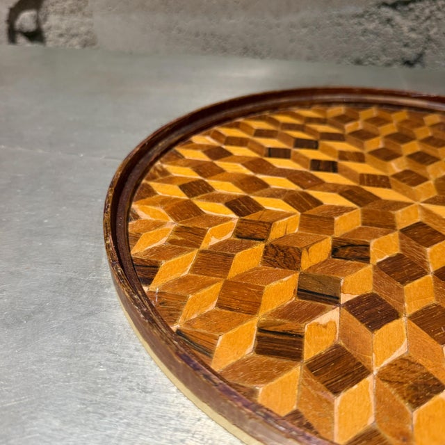 For your consideration, an antique round service tray or tabletop featuring a "tumbling blocks" parquetry design, a...
